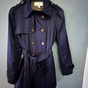 Cute blue trench never worn. All buttons are wooden, not metal.
